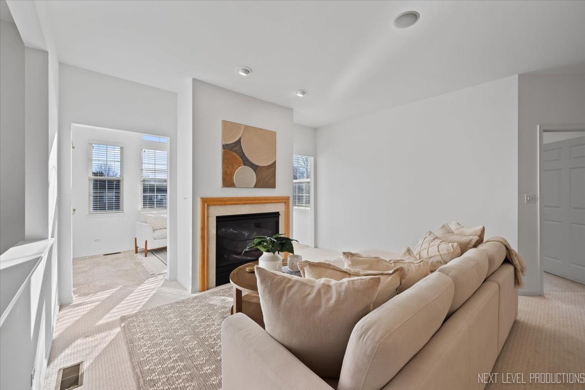 810 Cambridge Drive Batavia, IL 60510 - Photo 9 of 34 a living room with furniture and a fireplace