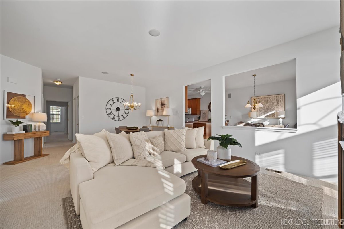 810 Cambridge Drive Batavia, IL 60510 - Photo 10 of 34 a living room with furniture and a flat screen tv