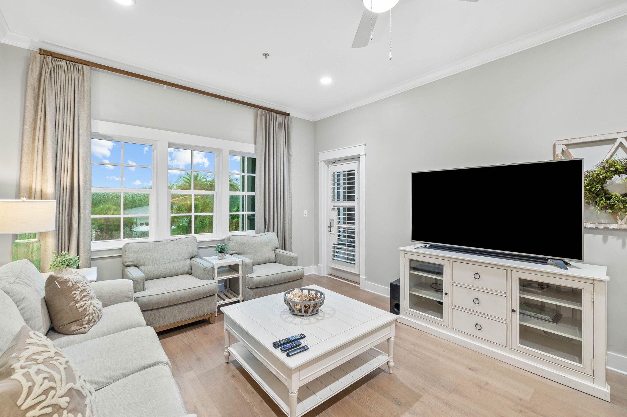 100 Matthew Boulevard, Unit 207 Destin, FL 32541 - Photo 18 of 29 a living room with furniture and a flat screen tv