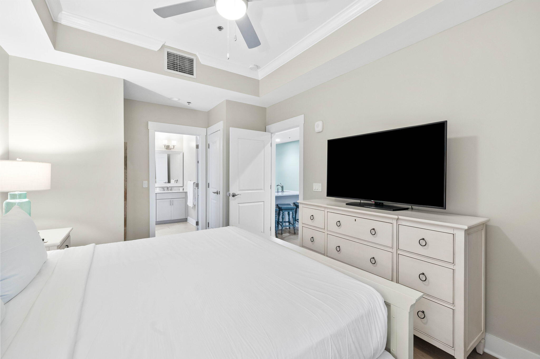 100 Matthew Boulevard, Unit 207 Destin, FL 32541 - Photo 22 of 29 a bedroom with a bed a flat screen tv and a view of bedroom