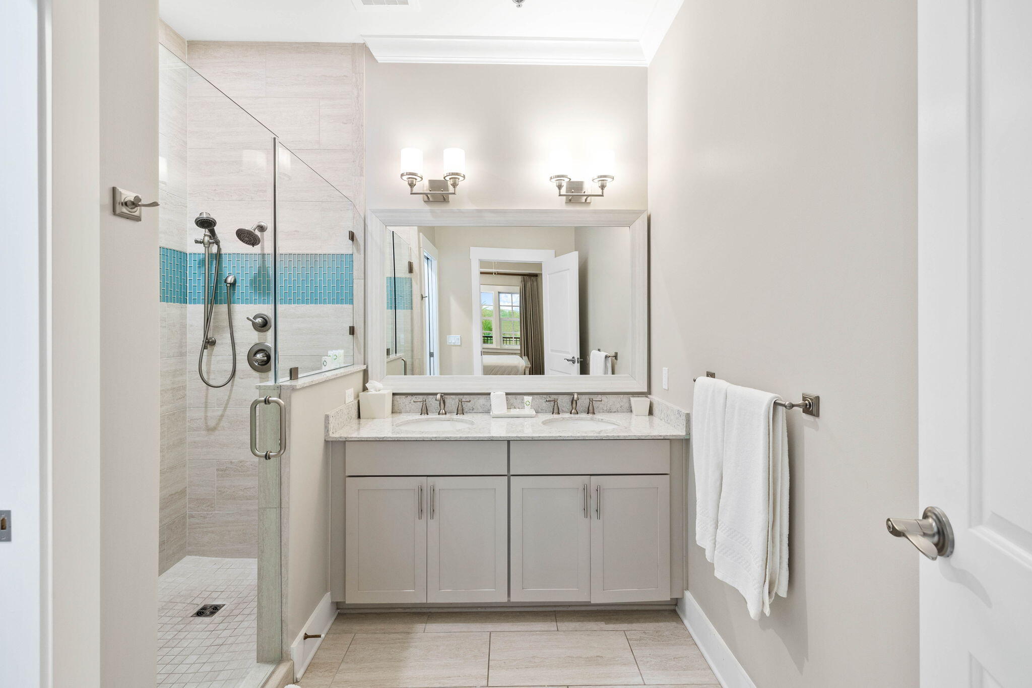 100 Matthew Boulevard, Unit 207 Destin, FL 32541 - Photo 23 of 29 a bathroom with a double vanity sink mirror and shower