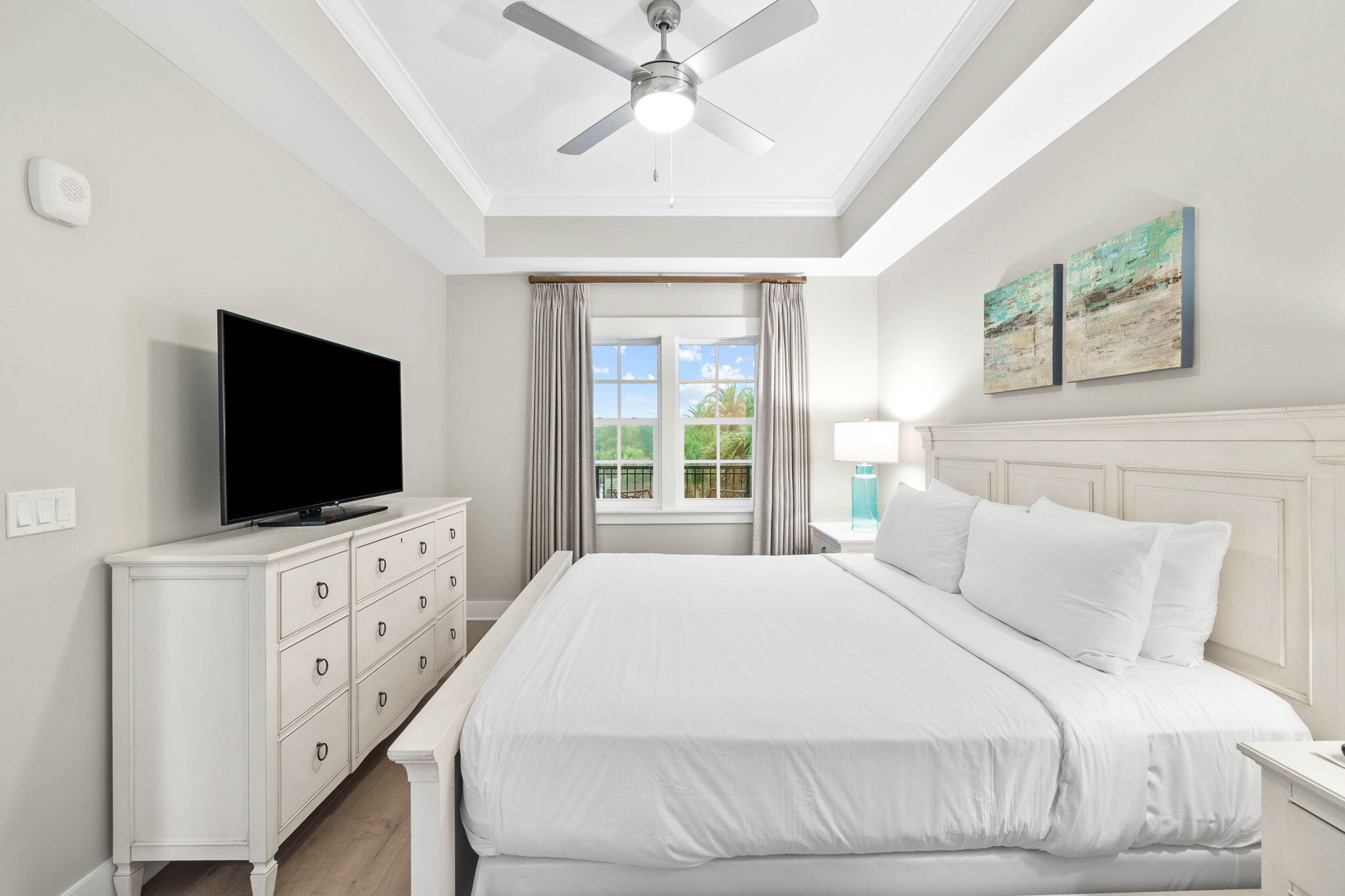 100 Matthew Boulevard, Unit 207 Destin, FL 32541 - Photo 25 of 29 a bedroom with a flat screen tv on dresser and a window