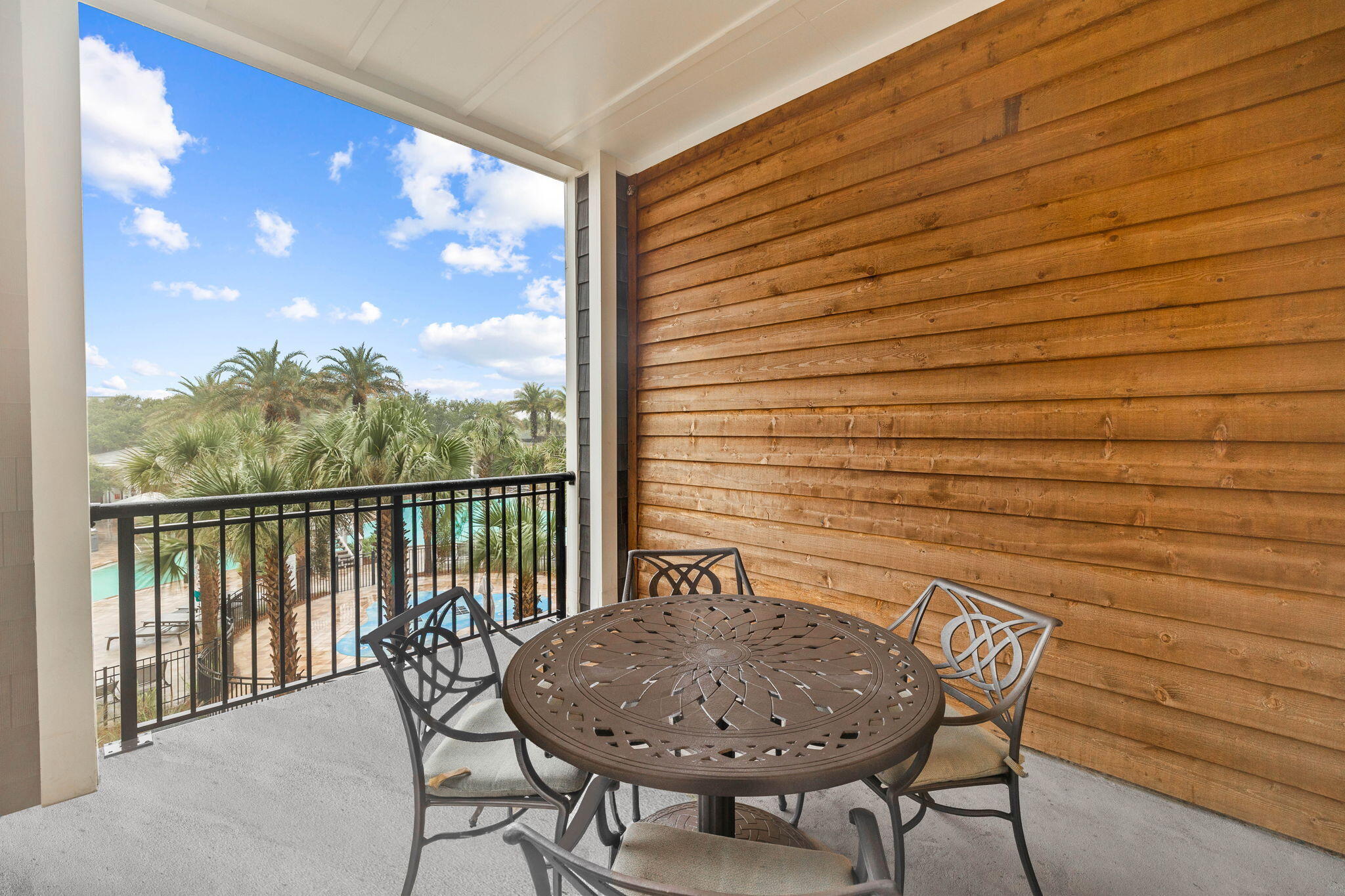 100 Matthew Boulevard, Unit 207 Destin, FL 32541 - Photo 26 of 29 a balcony with table and chairs