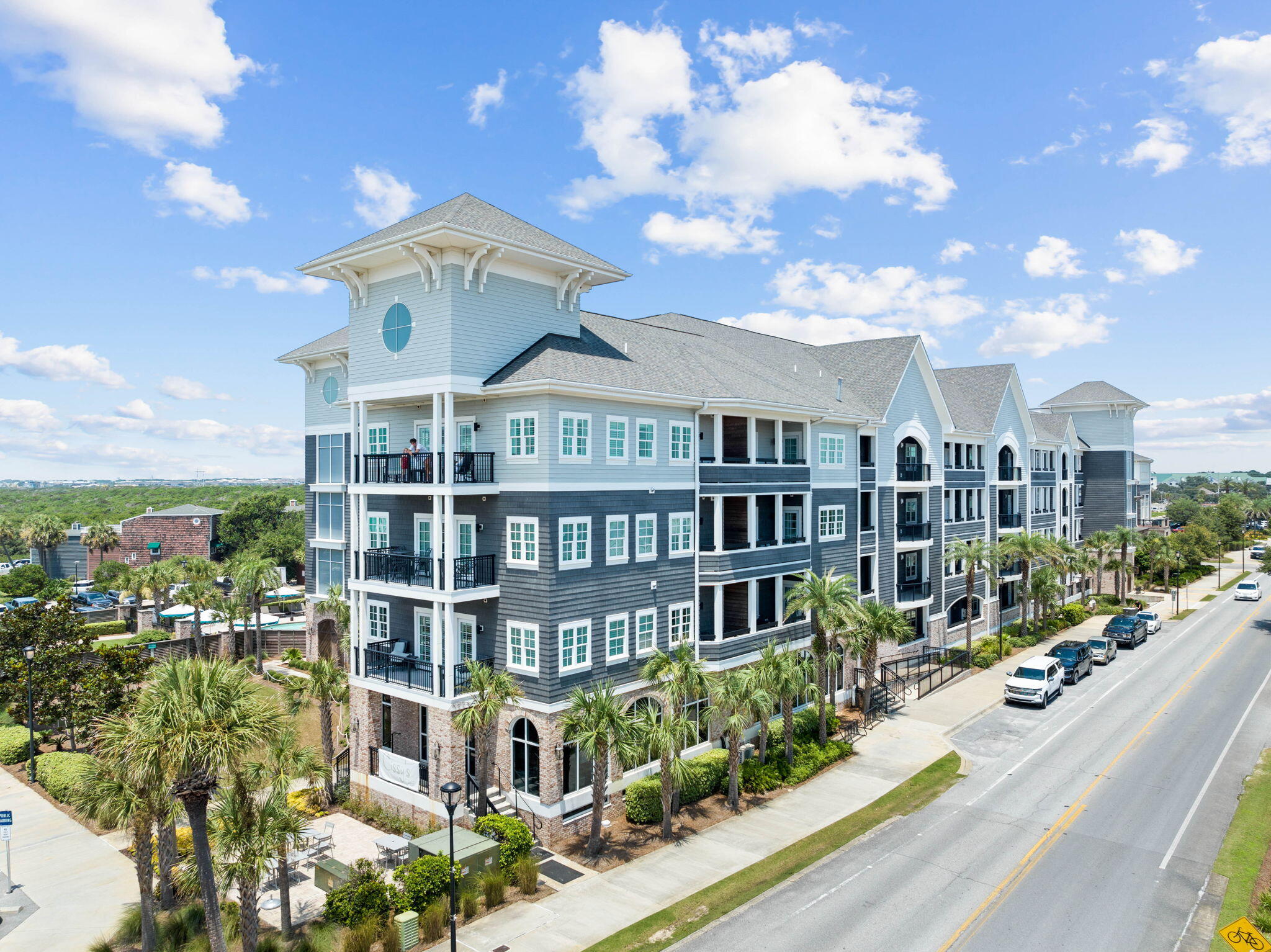 100 Matthew Boulevard, Unit 207 Destin, FL 32541 - Photo 28 of 29 a front view of a residential apartment building with a yard