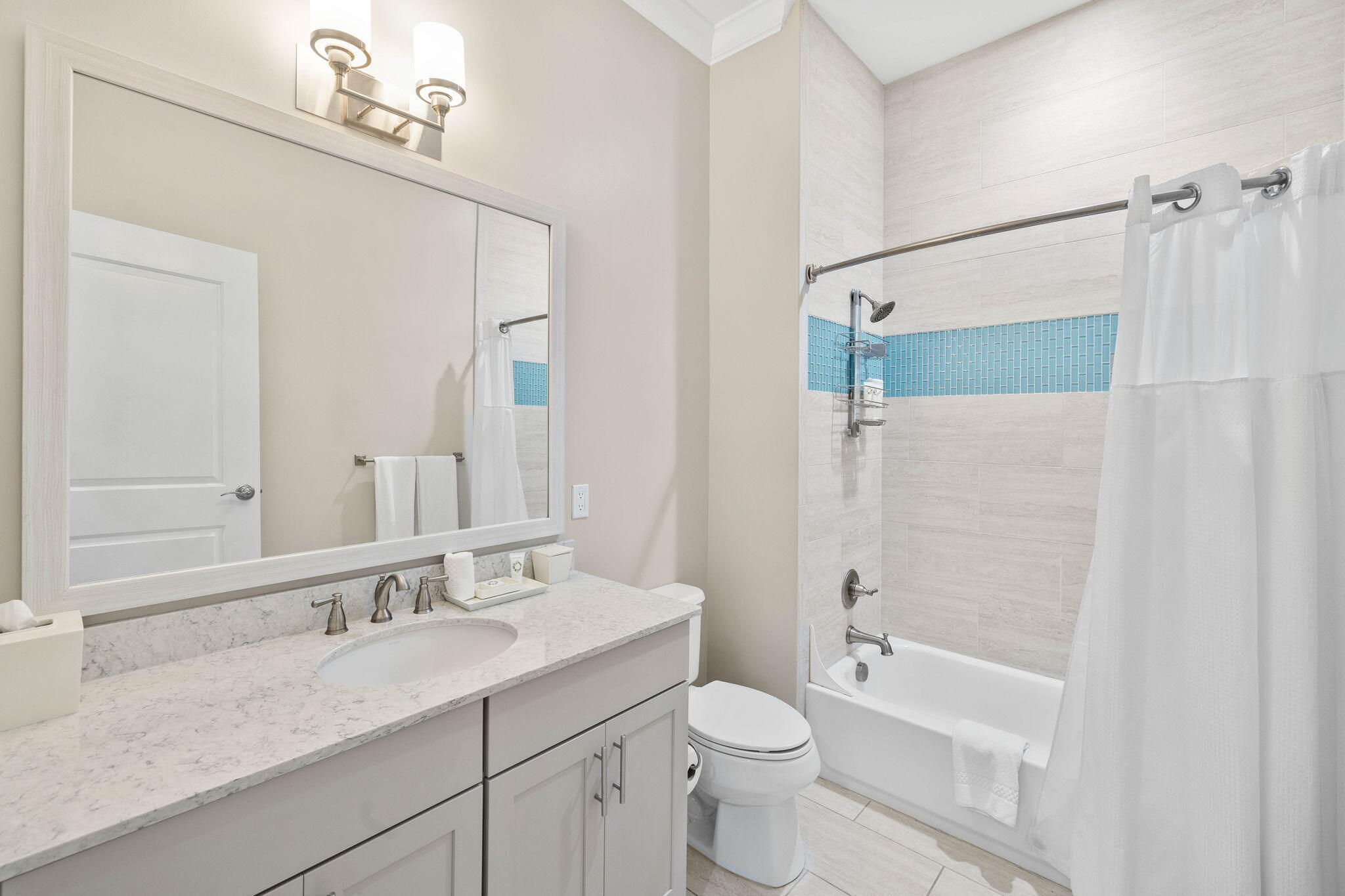 100 Matthew Boulevard, Unit 207 Destin, FL 32541 - Photo 6 of 29 a bathroom with a granite countertop sink a toilet and shower
