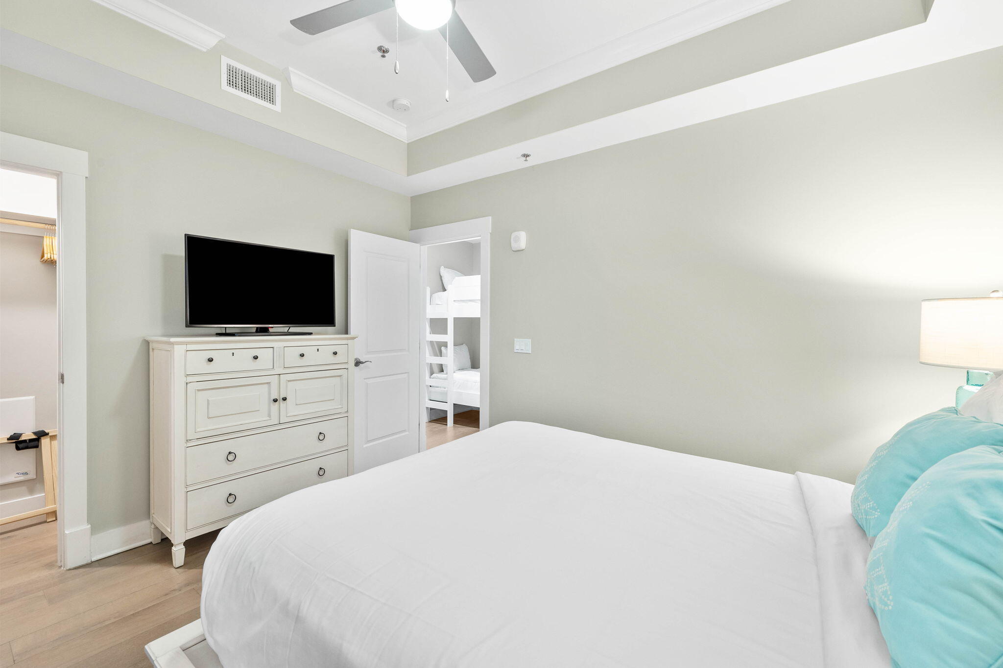 100 Matthew Boulevard, Unit 207 Destin, FL 32541 - Photo 8 of 29 a bedroom with a bed and a flat screen tv