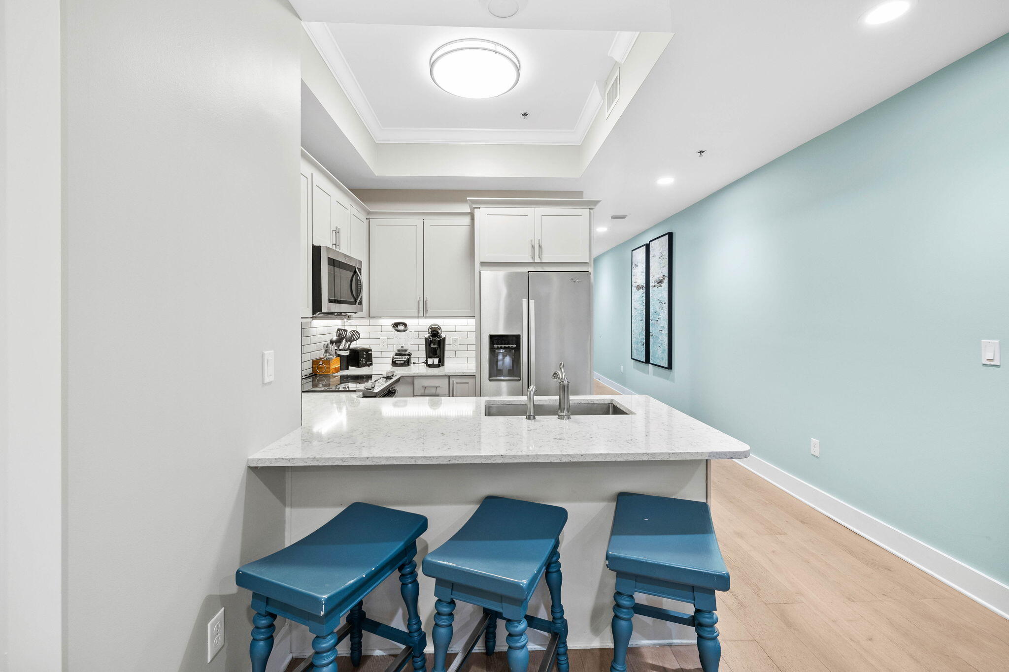 100 Matthew Boulevard, Unit 207 Destin, FL 32541 - Photo 10 of 29 a view of kitchen island a sink and chairs