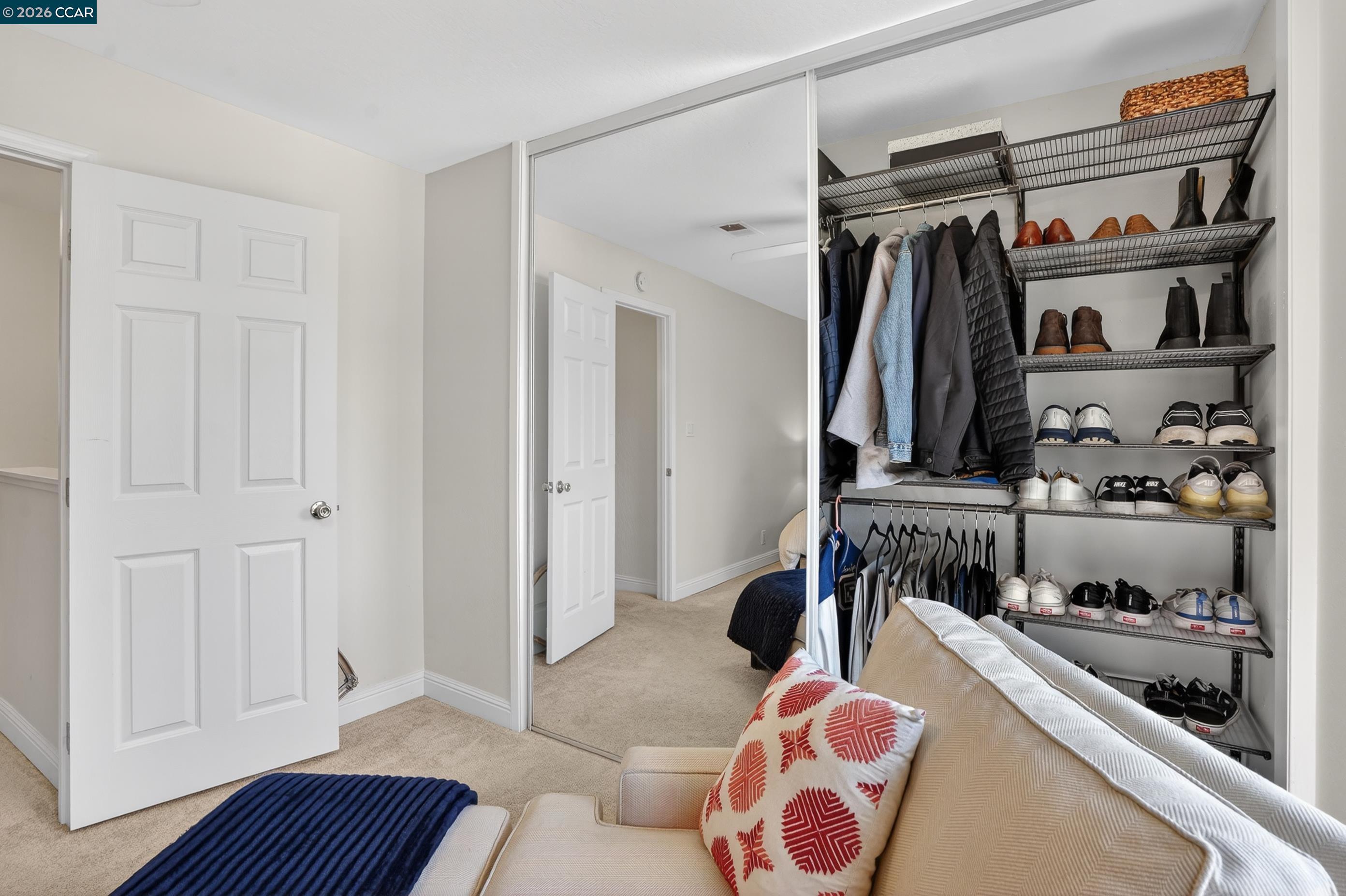 1812 Wildbrook Court, Unit C Concord, CA 94521 - Photo 25 of 35 a walk in closet with clothes and shoes