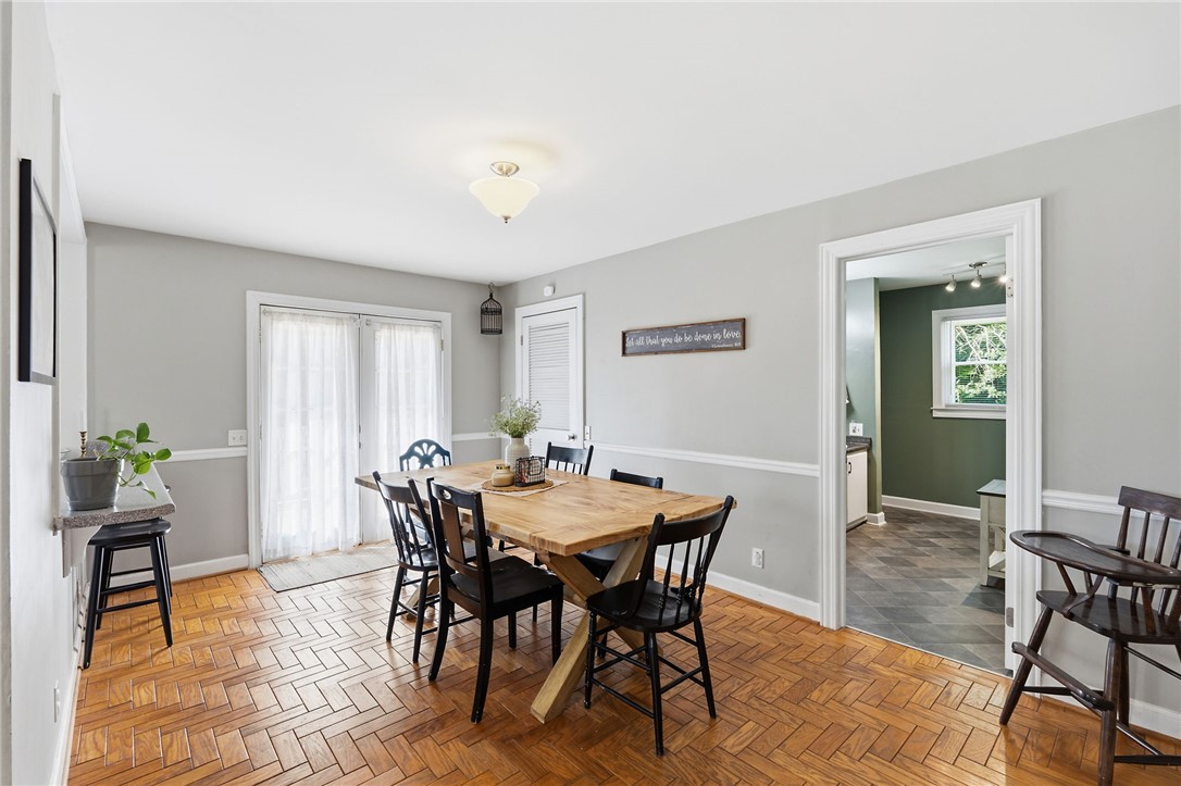 108 Tarrant Street Central, SC 29630 - Photo 11 of 42 Herringbone wood flooring defines this comfortable dining area with French doors.