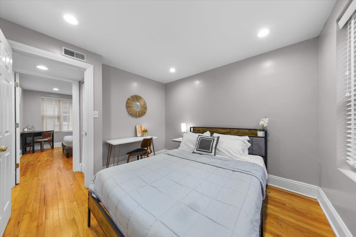 7423 North Sheridan Road, Unit 2W Chicago, IL 60626 - Photo 13 of 16 a bedroom with a bed and a view of living room