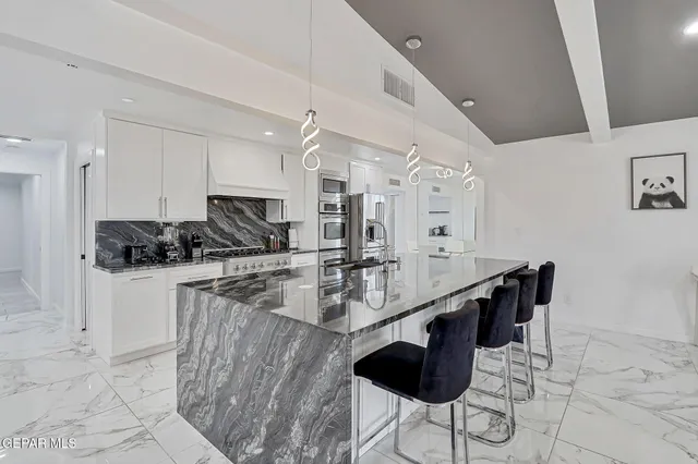 a bedroom with a bed and a mirror