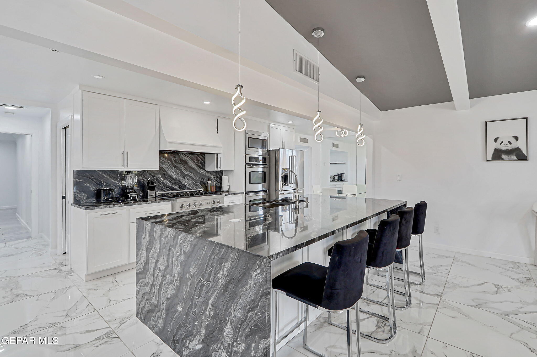 259 Crown Point Drive El Paso, TX 79912 - Photo 19 of 43 a kitchen with stainless steel appliances kitchen island granite countertop a sink and cabinets