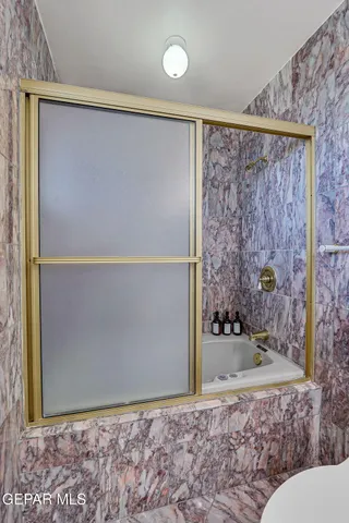 a bedroom with a bed and a view living room