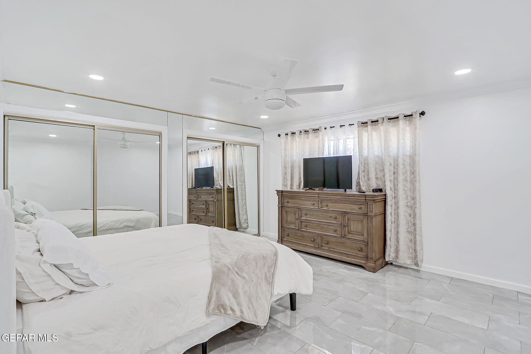 259 Crown Point Drive El Paso, TX 79912 - Photo 26 of 43 a bedroom with a bed and a dresser