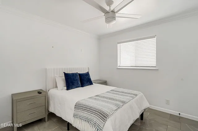 a bathroom with double vanity sinks and a mirror