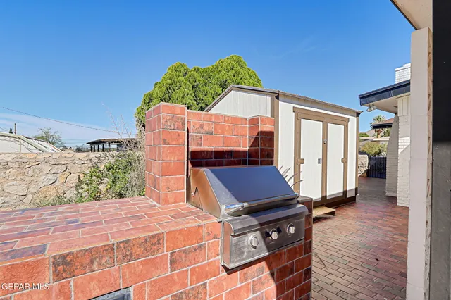 a front view of a house with trees