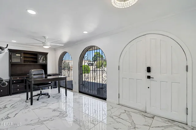 a view of workspace with a window and wooden floor
