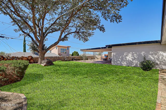 a view of a back yard of a house
