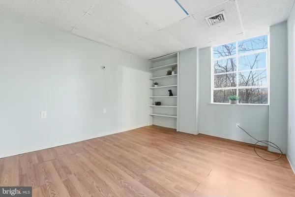 a view of empty room with windows