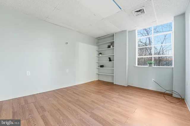 a view of empty room with windows