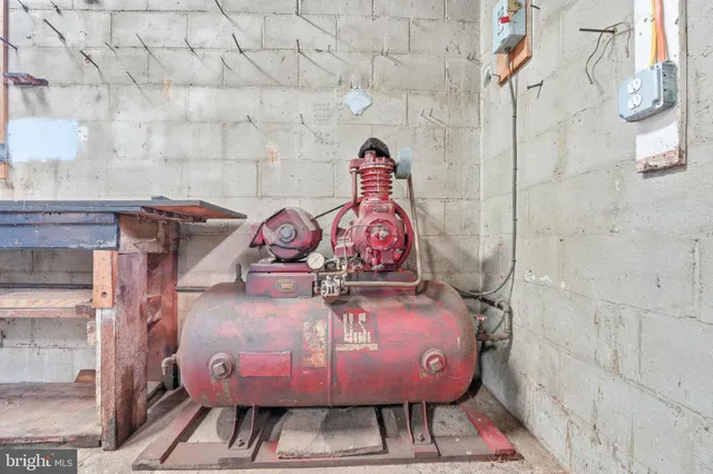 a view of a gallery with rack and wooden floor