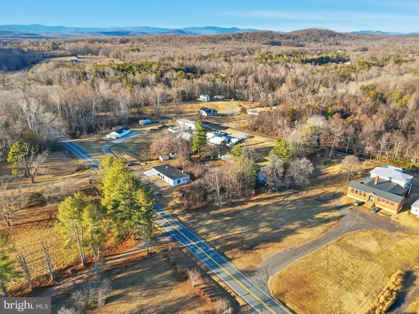 a view of a pathway with a flower garden