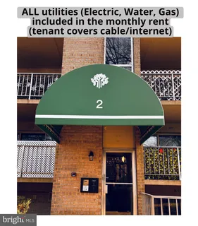 a view of a house with backyard and porch