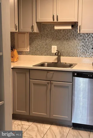 a view of a hallway with wooden floor and windows