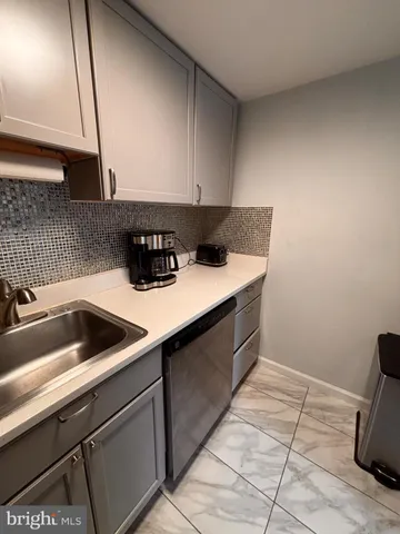 a bedroom with a bed and flat screen tv