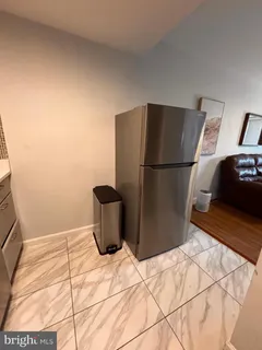 a bedroom with a bed and two windows