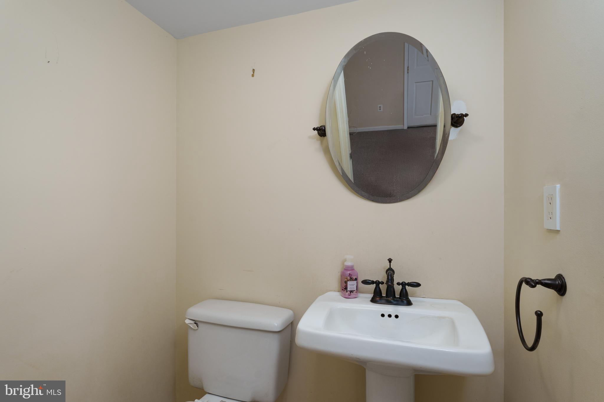 190 Mercer Street Trenton, NJ 08611 - Photo 24 of 34 a bathroom with a sink and mirror