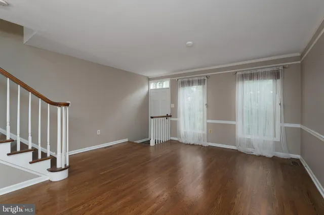a view of wooden floor and brick walls