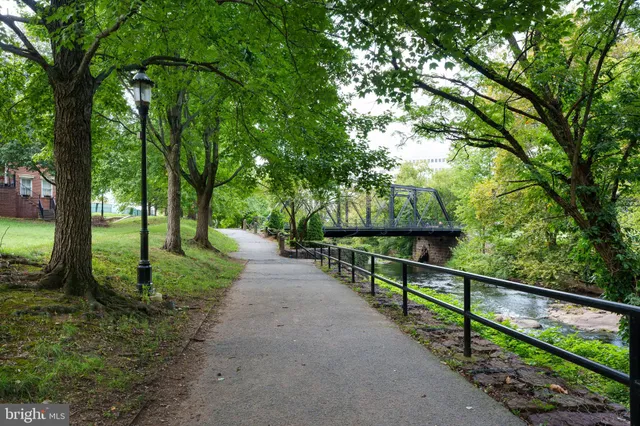 a balcony with wooden floor and lake view