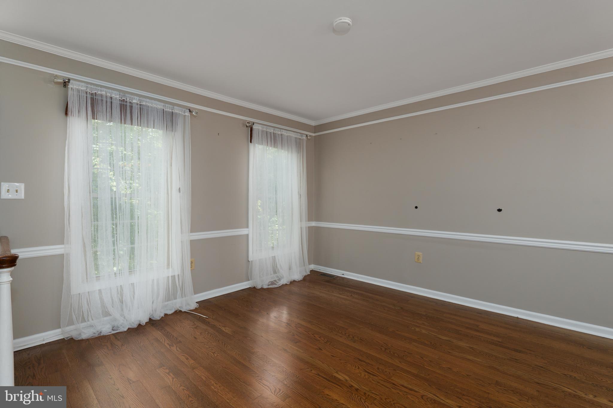 190 Mercer Street Trenton, NJ 08611 - Photo 6 of 34 a view of an empty room with wooden floor and a window