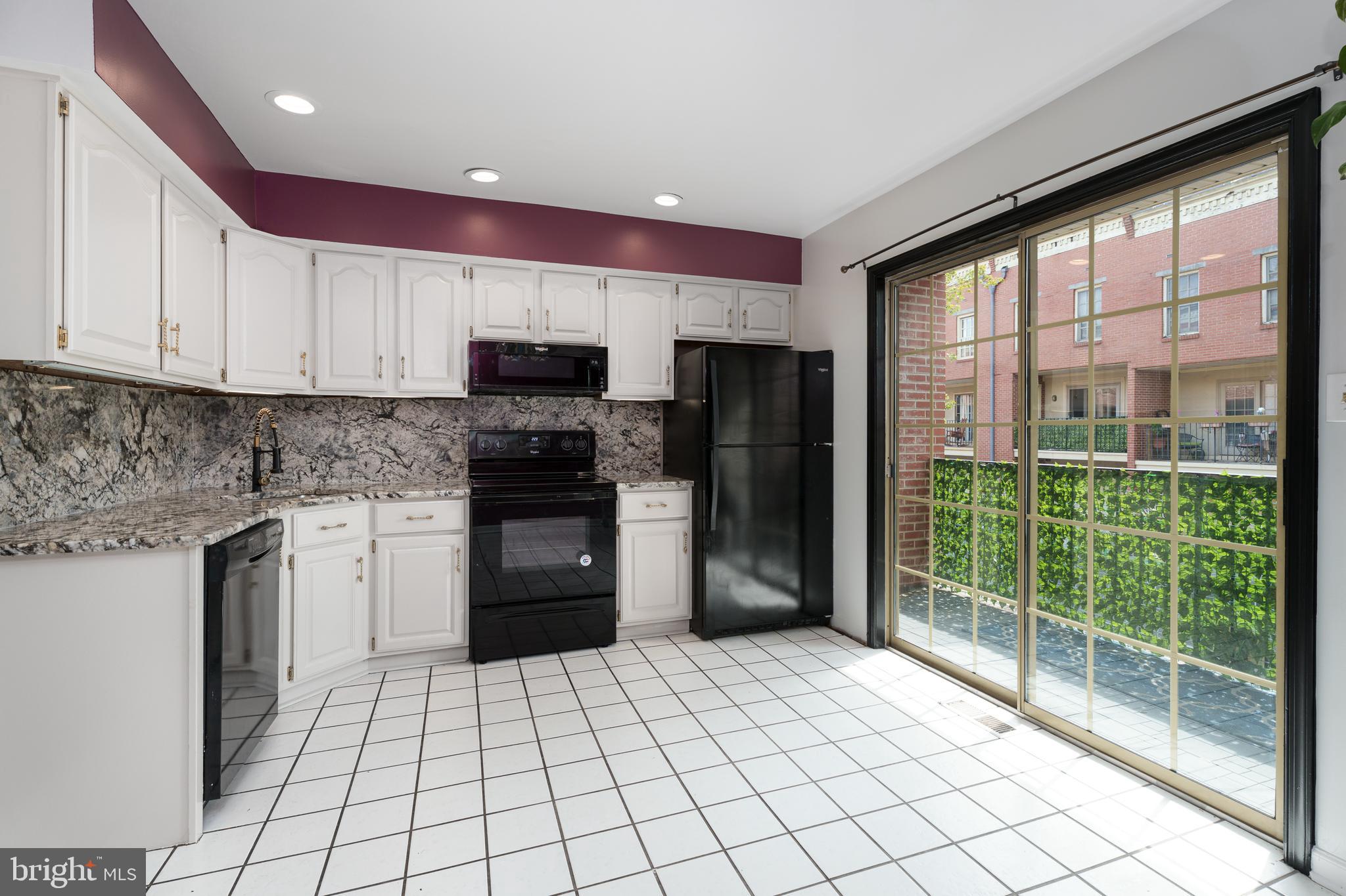 190 Mercer Street Trenton, NJ 08611 - Photo 9 of 34 a kitchen with stainless steel appliances granite countertop a refrigerator and a sink