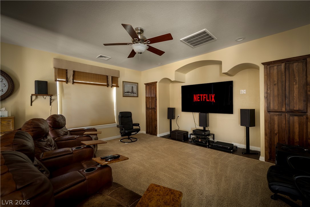 2181 Winery Road Pahrump, NV 89048 - Photo 30 of 52 Cozy living space for entertainment with ceiling fan and surround sound for comfort and theater like feel.