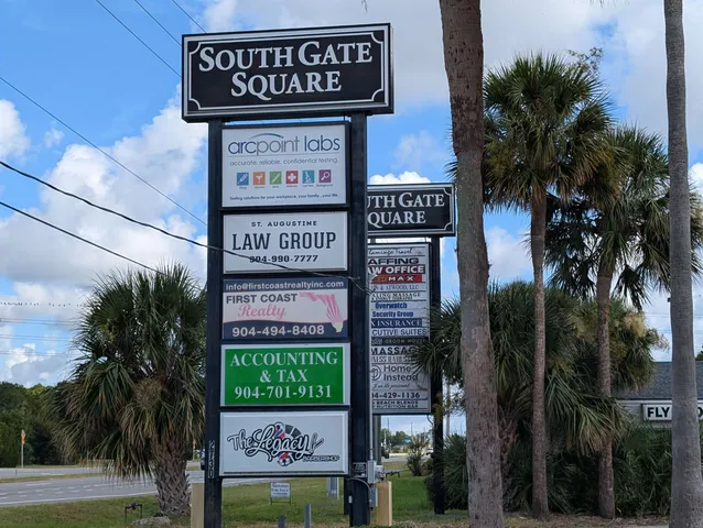 a sign on a pole on a street