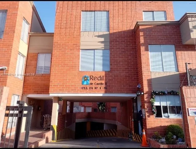 a view of a brick building with many windows