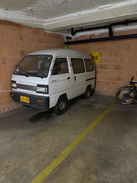 174-8-90 Calle Queens, FL 11101 - Photo 16 of 16 a view of car parking