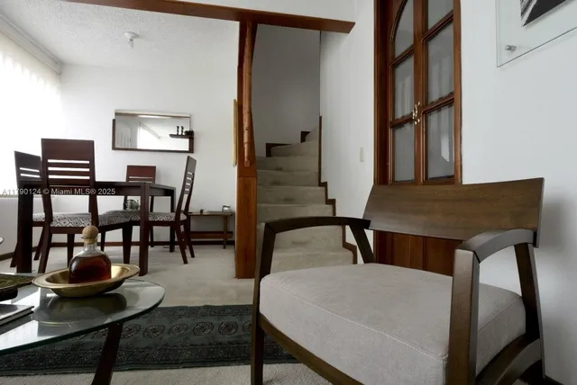 a view of a livingroom with furniture and window