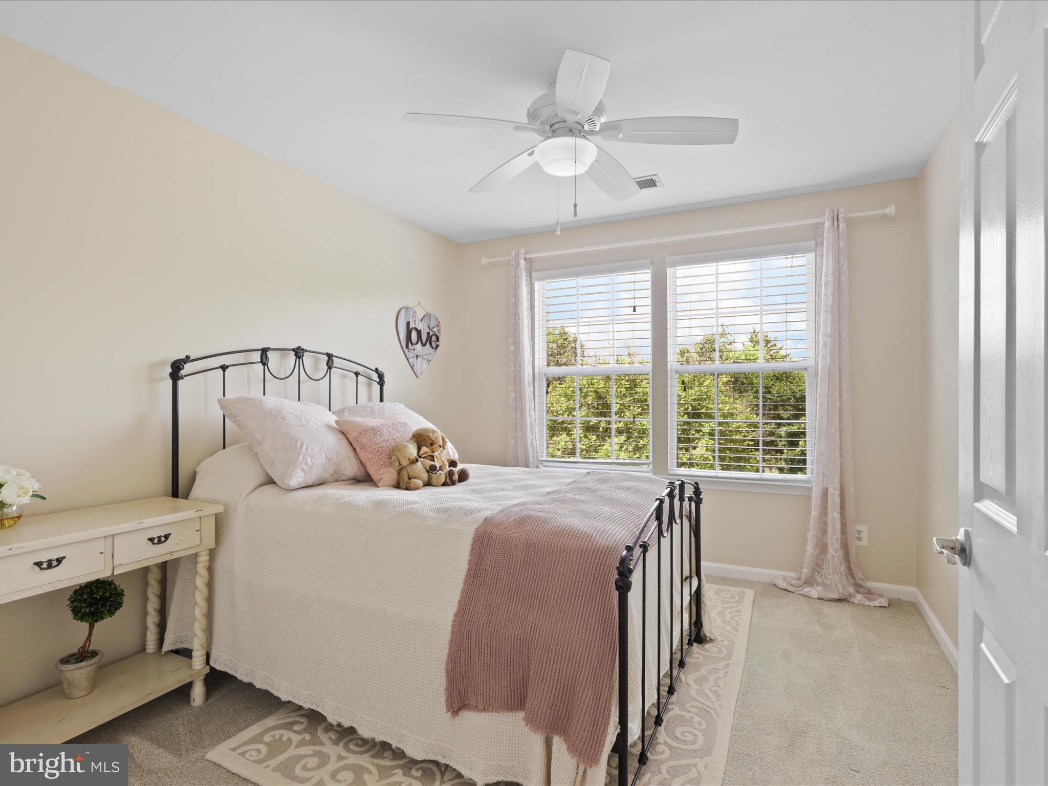 25530 Chilmark Drive Chantilly, VA 20152 - Photo 33 of 67 a bedroom with a bed and a chandelier