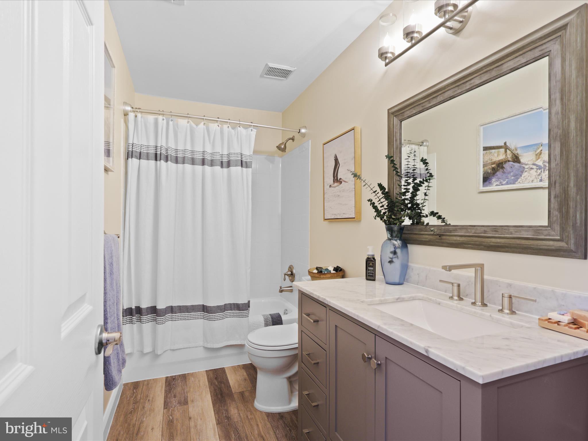 25530 Chilmark Drive Chantilly, VA 20152 - Photo 34 of 67 a bathroom with a sink vanity mirror and toilet