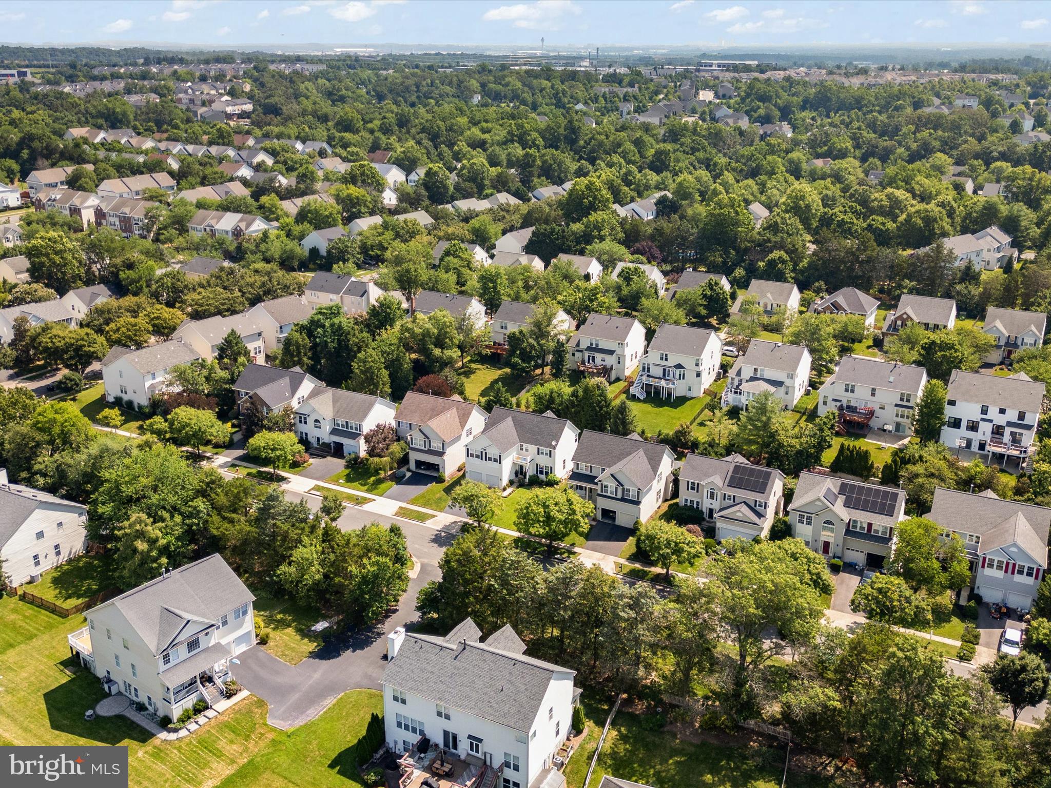 25530 Chilmark Drive Chantilly, VA 20152 - Photo 54 of 67 an aerial view of residential houses with outdoor space and trees