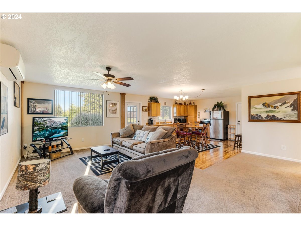 25970 South Wallens Road Estacada, OR 97023 - Photo 23 of 48 a living room with furniture and a large window