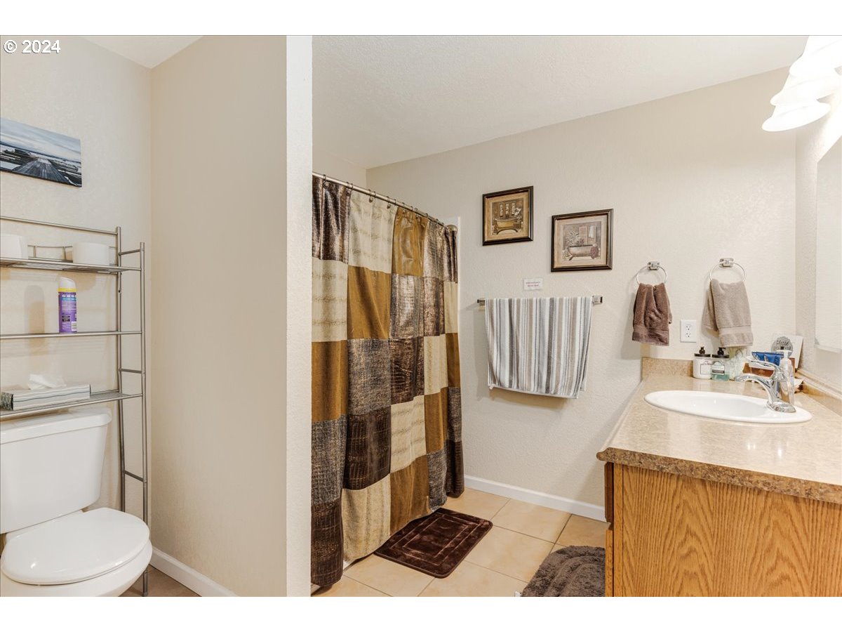25970 South Wallens Road Estacada, OR 97023 - Photo 26 of 48 a bathroom with a sink toilet and shower