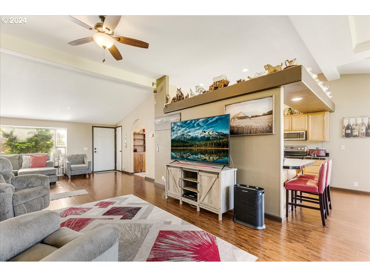 25970 South Wallens Road Estacada, OR 97023 - Photo 6 of 48 a bedroom with furniture and a flat screen tv
