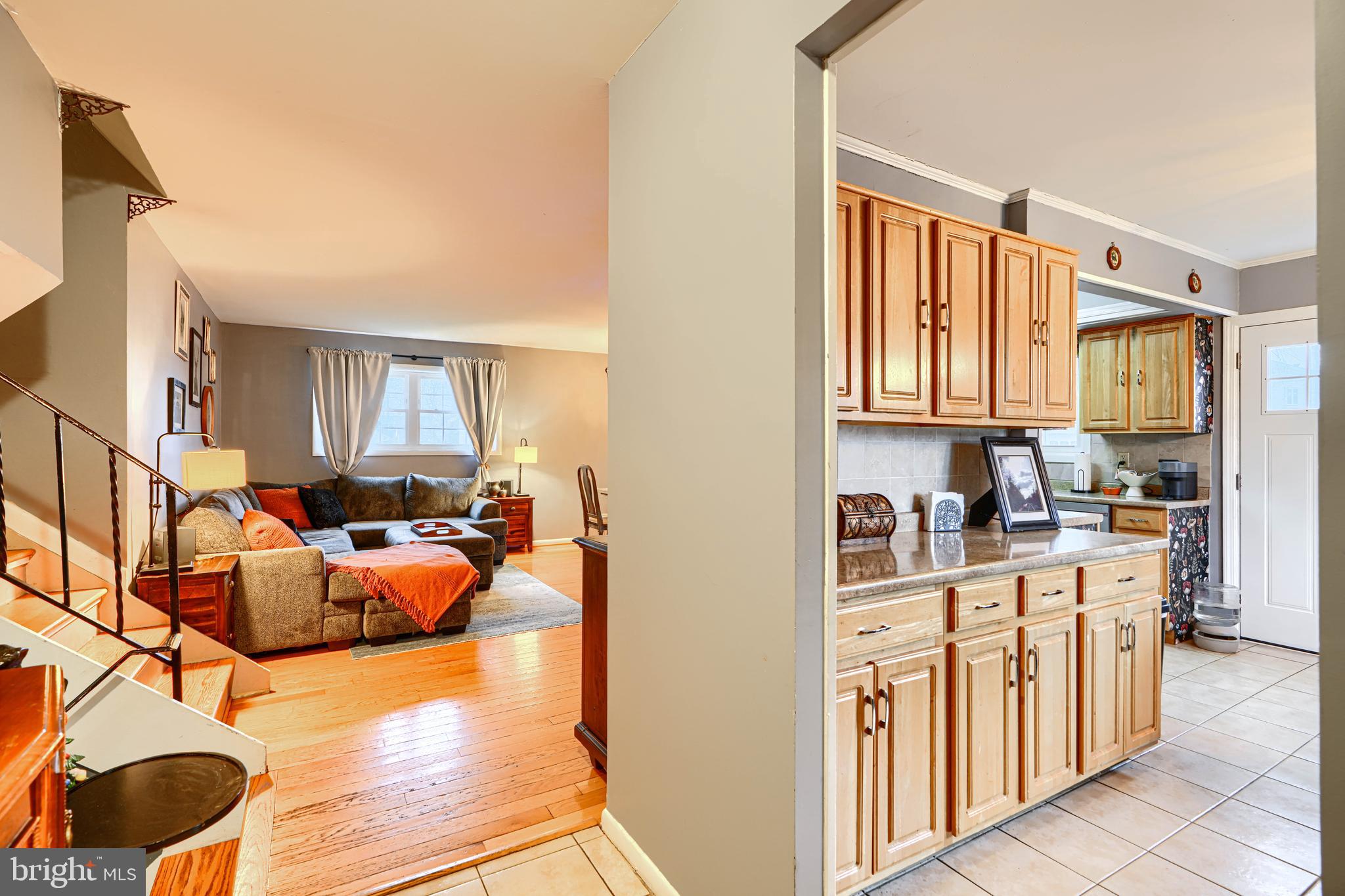 3007 Marlin Drive Riva, MD 21140 - Photo 5 of 34 a living room with furniture a rug kitchen view and a window
