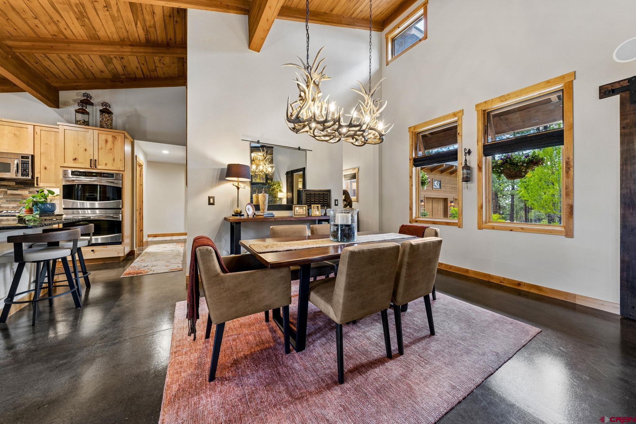 24 Monarch Crest Trail Durango, CO 81301 - Photo 10 of 45 a dining room with furniture a rug and wooden floor