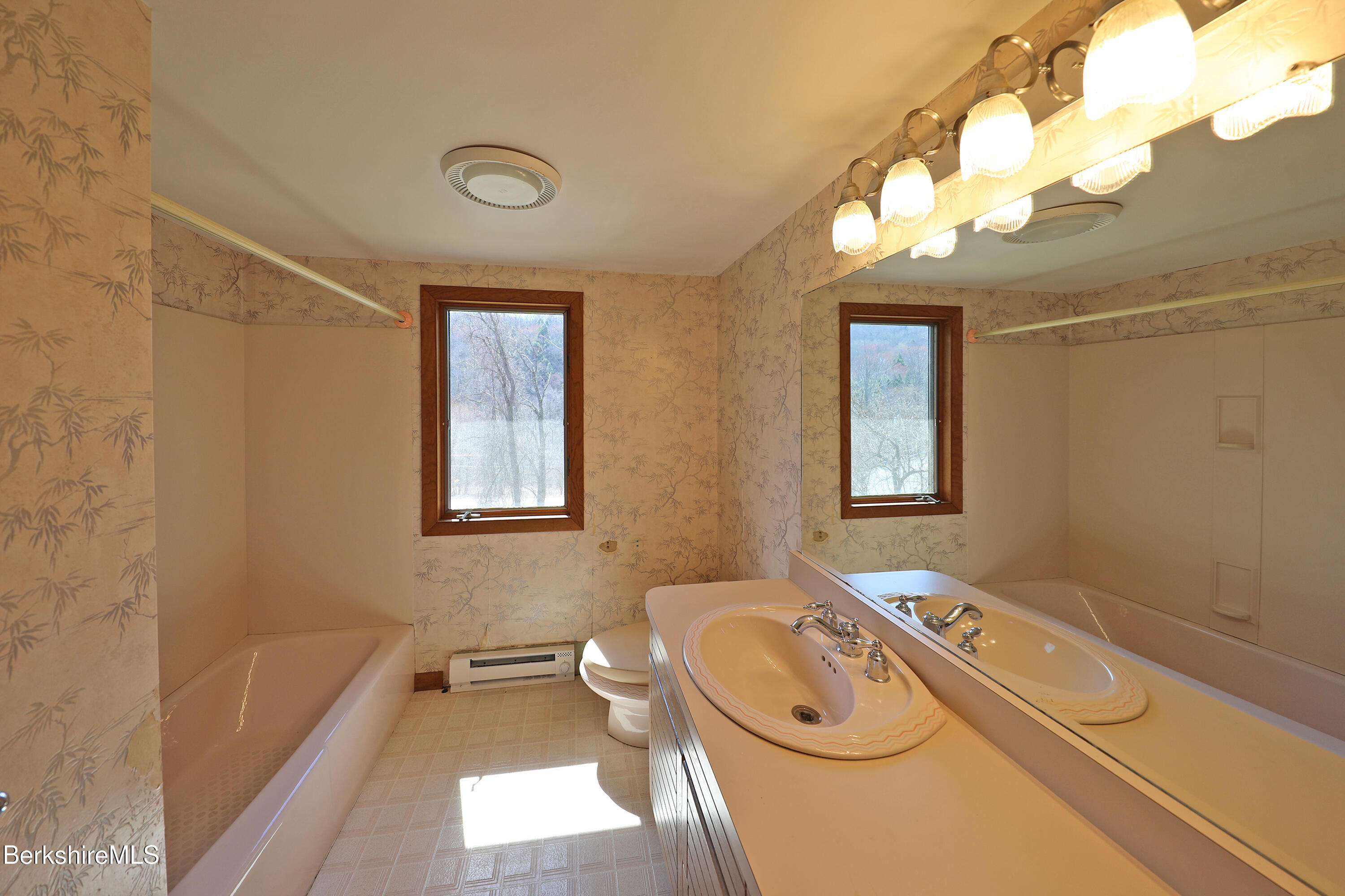 519 Kirchner Road Dalton, MA 01226 - Photo 24 of 42 a bathroom with a granite countertop sink mirror vanity bathtub and a toilet