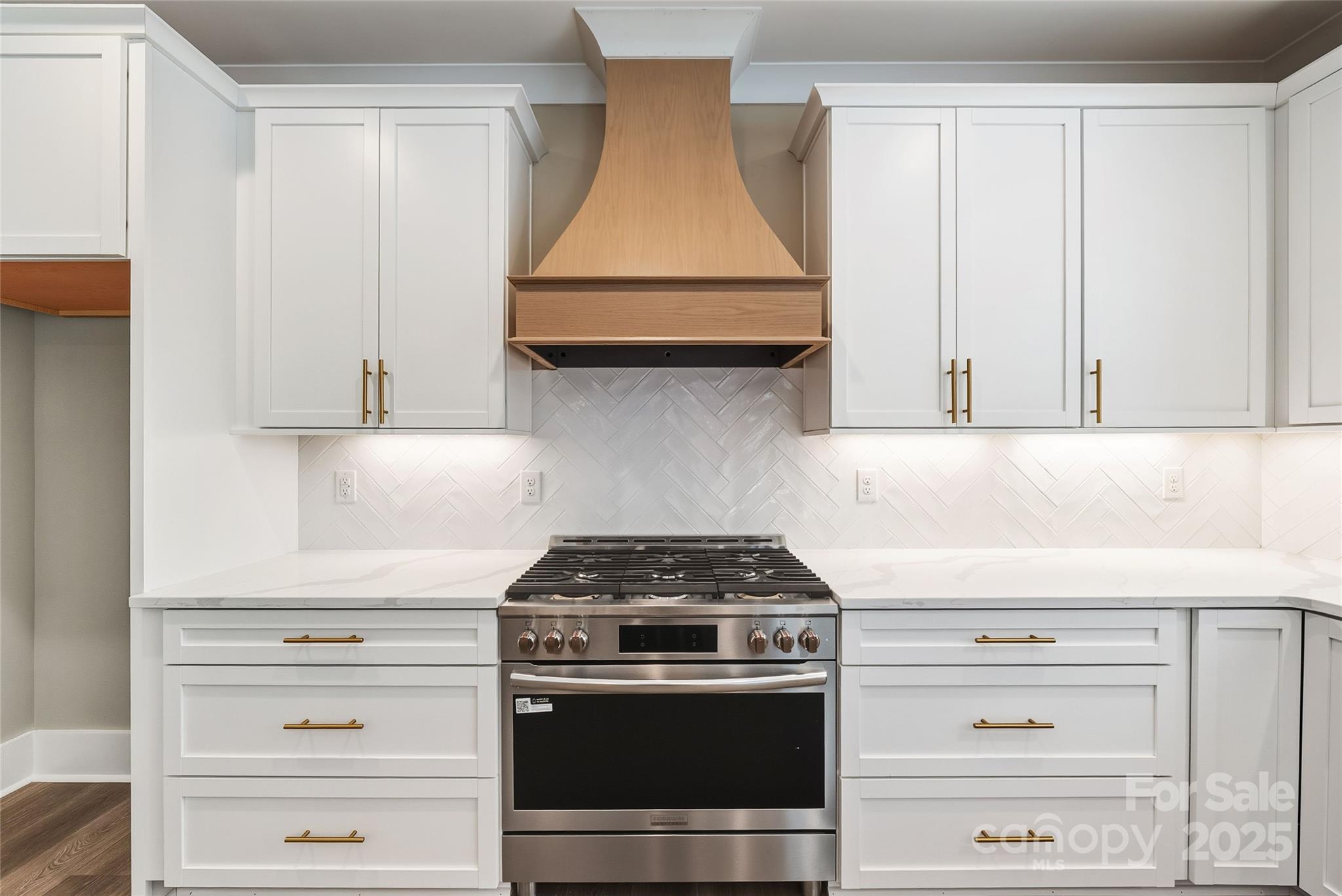 1913 Snyders Store Road, Unit 5 Wingate, NC 28174 - Photo 14 of 48 a kitchen with granite countertop white cabinets and a stove